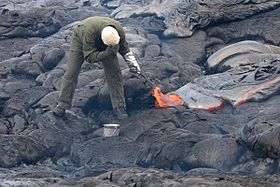 280px-Sampling_lava_with_hammer_and_bucket.jpg