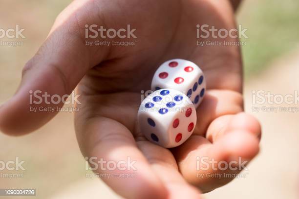 hand-holding-a-pair-of-dice.jpg